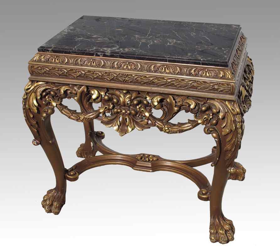 Appraisal: ORNATELY CARVED AND GILT MARBLE TOP HALL TABLE th century