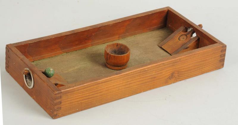 Appraisal: Marble Target Game Rectangular dovetailed open box with heavily sprung