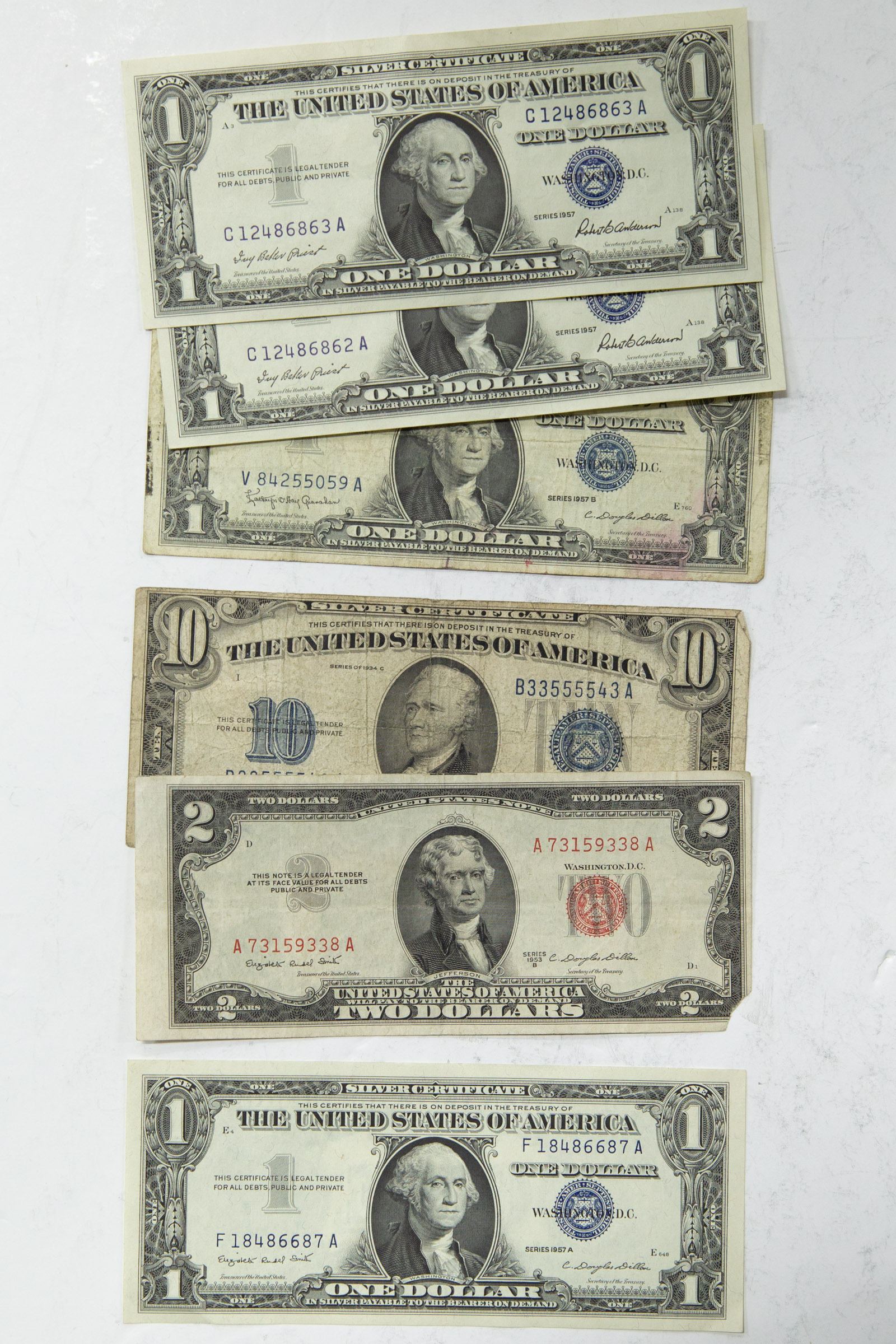 Appraisal: FOUR SILVER CERTIFICATES ONE SILVER CERTIFICATE - C VG with