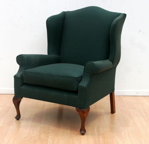 Appraisal: A reproduction wing back armchair