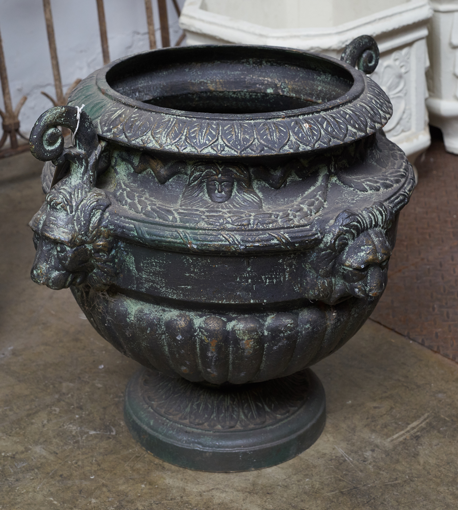 Appraisal: AN EARLY th CENTURY CAST IRON PLANTER Lion head decoration