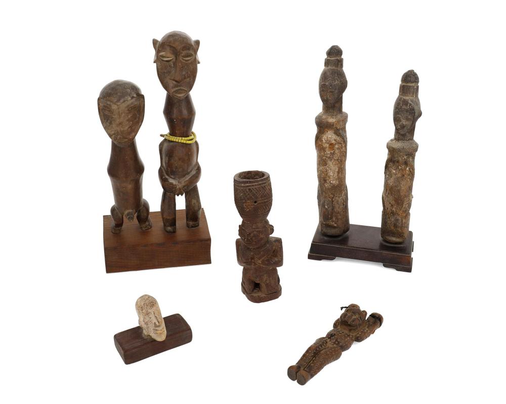 Appraisal: A group of African figures th Century Comprising carved wood