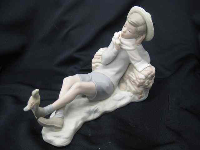 Appraisal: Lladro Porcelain Figurine of Reclining Boywith bird resting upon his