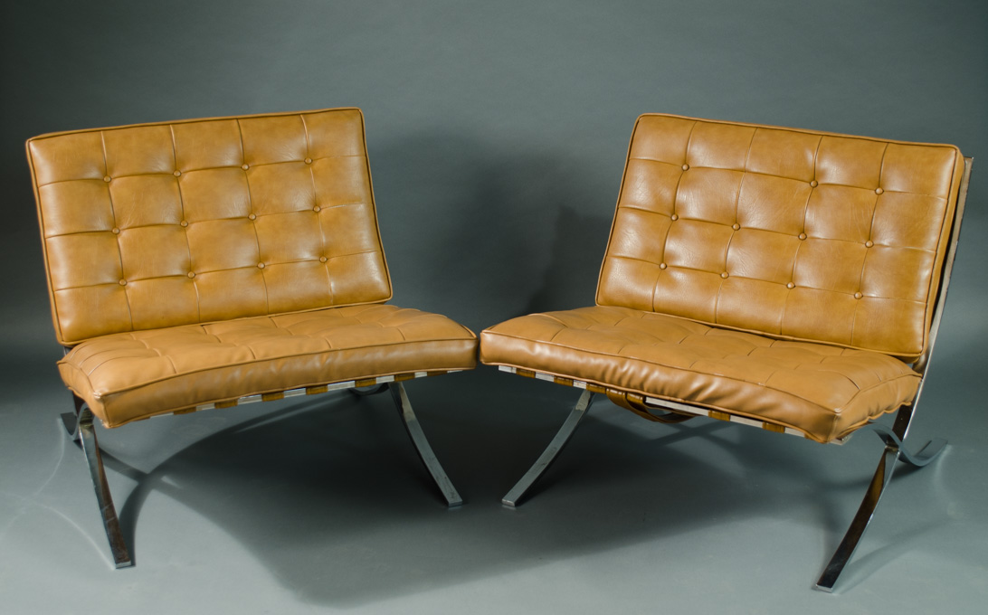 Appraisal: A PAIR OF BROWN VINYL AND CHROMED STEEL BARCELONA LOUNGE