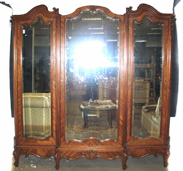 Appraisal: A Louis XV style kingwood veneered three door armoire crack