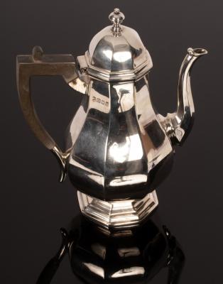 Appraisal: An octagonal pear-shaped silver coffee pot Sheffield with hinged domed