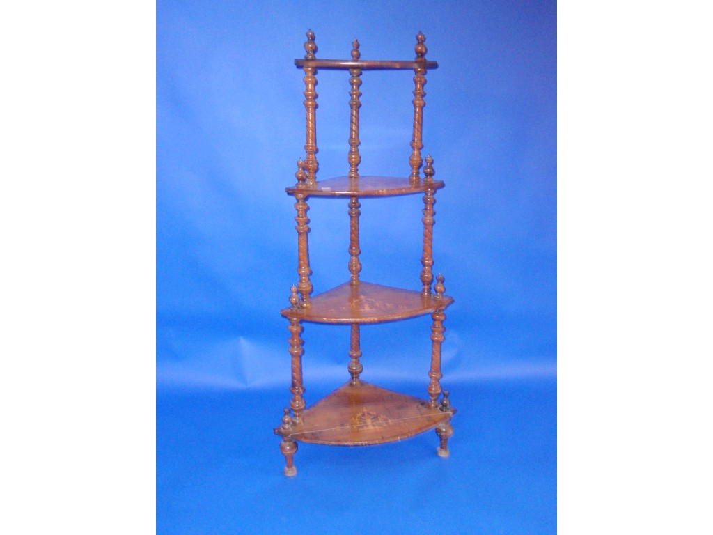 Appraisal: A Victorian walnut marquetry four tier corner whatnot