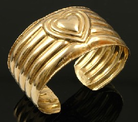 Appraisal: HEART CUFF BANGLE SET IN CT GOLD WEIGHING APPROXIMATELY GMS