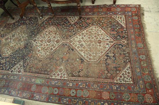 Appraisal: HAND KNOTED PERSIAN SHIRAZ RUG with threee stepped medallions First