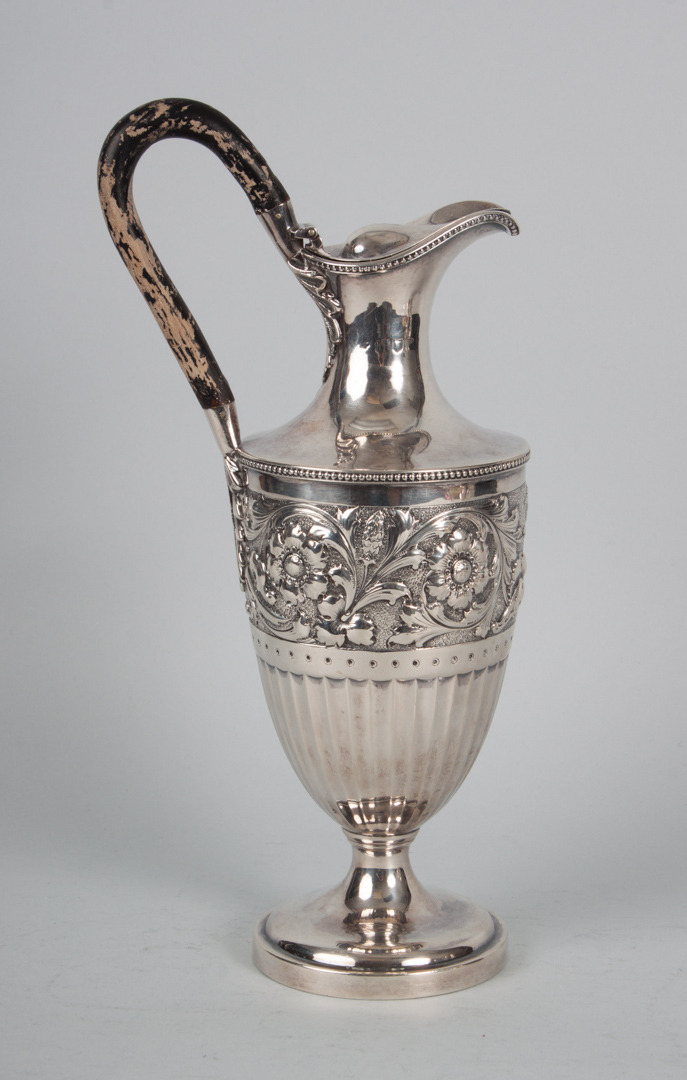 Appraisal: English sterling silver repousse ewer in the Neoclassical taste William