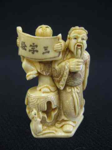 Appraisal: Carved Ivory Netsuke of a Bearded Man with child holding