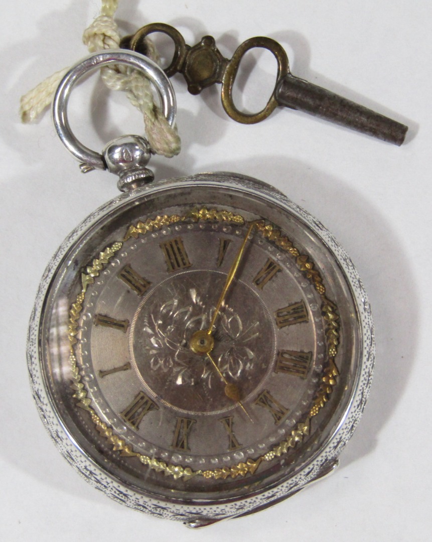 Appraisal: A silver fob watch engraved overall damascened dial with gold