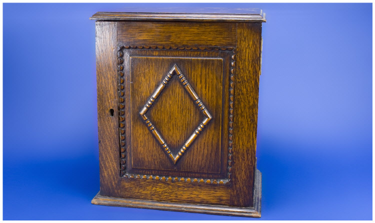 Appraisal: Oak Smokers Cabinet Carved Front Opens To Reveal A Fitted