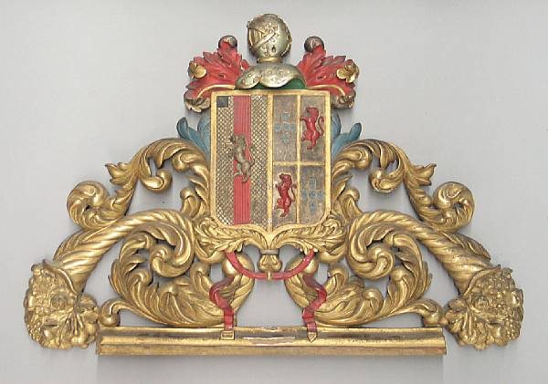 Appraisal: An Iberian Baroque style carved gilt and polychrome wood armorial