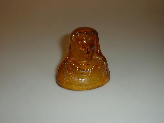 Appraisal: An amber glass bust of Queen Victoria stress fracture