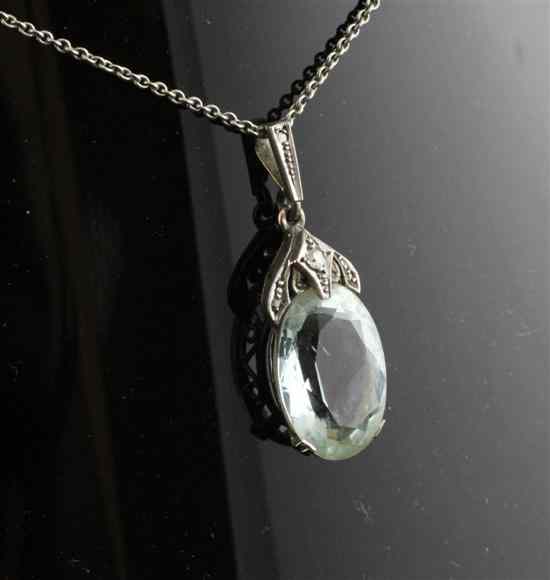 Appraisal: A ct white gold diamond and aquamarine drop pendant on