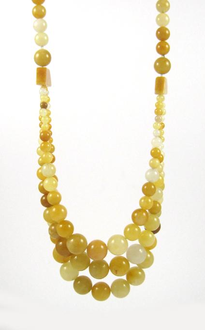 Appraisal: BUTTER JADE BEAD NECKLACE with a single strand and three