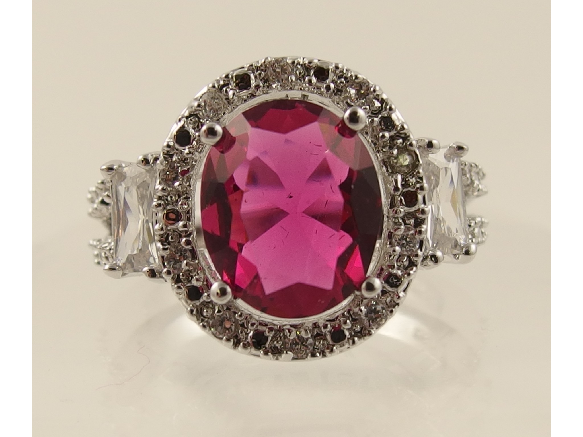 Appraisal: A silver white topaz and pink gem stone ring