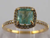 Appraisal: A white metal tests carat gold emerald and diamond ring