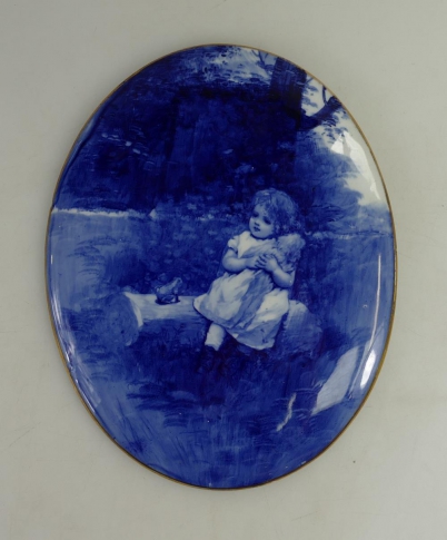 Appraisal: Doulton Burslem blue white oval plaque decorated with girl with