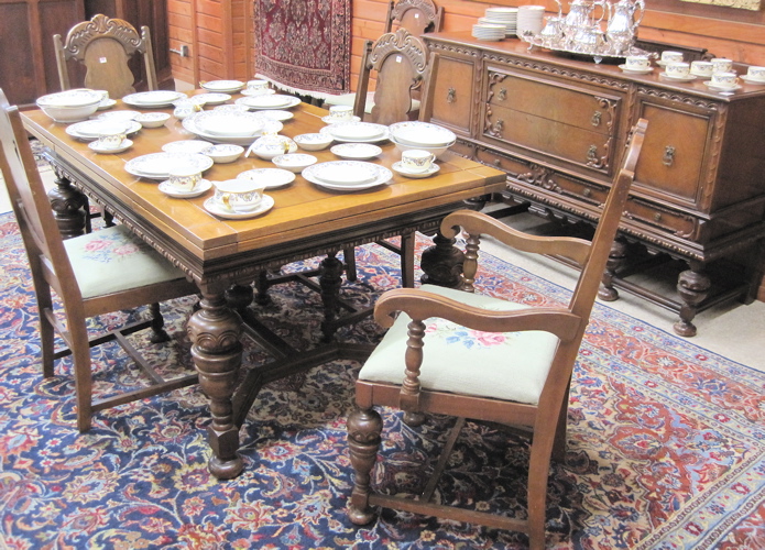 Appraisal: EIGHT-PIECE WALNUT DINING SET American c 's comprising rectangular draw-leaf