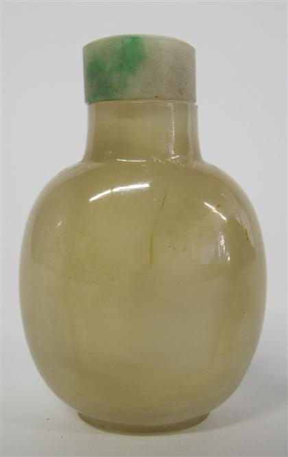 Appraisal: Chinese agate snuff bottle The slender and unadorned ovoid bottle