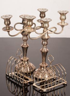 Appraisal: A pair of Sheffield plate two-branch three-light candelabra with gadroon