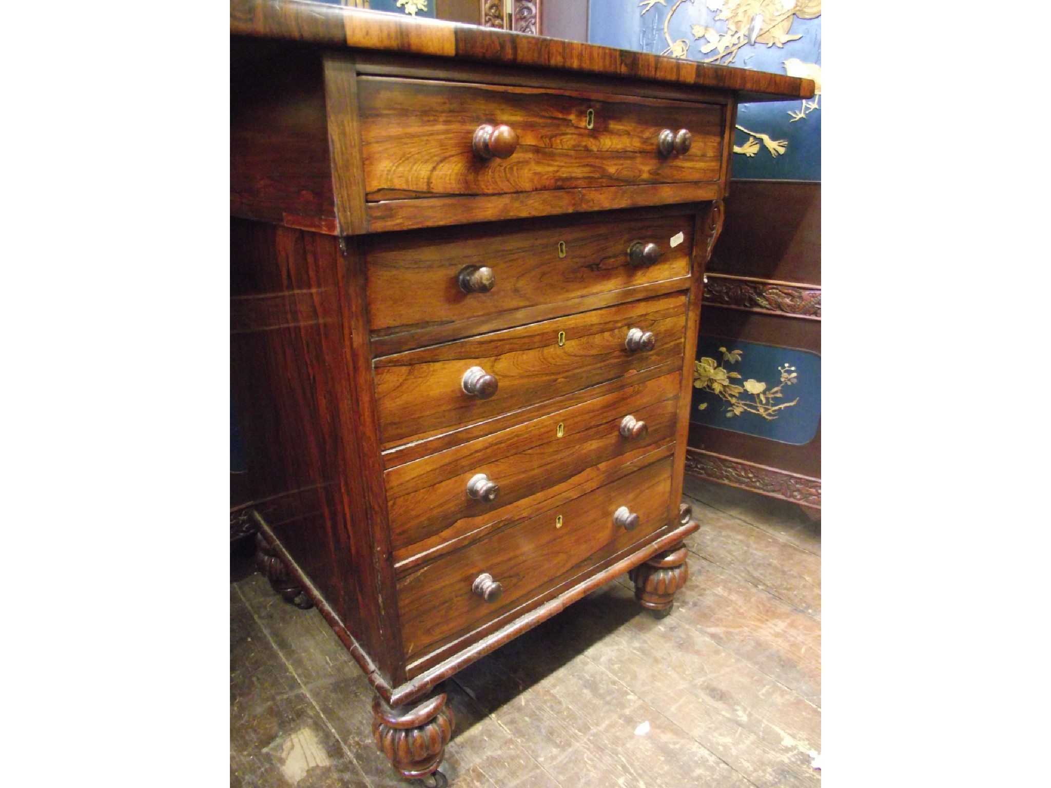 Appraisal: A Regency rosewood writing desk the column base set with