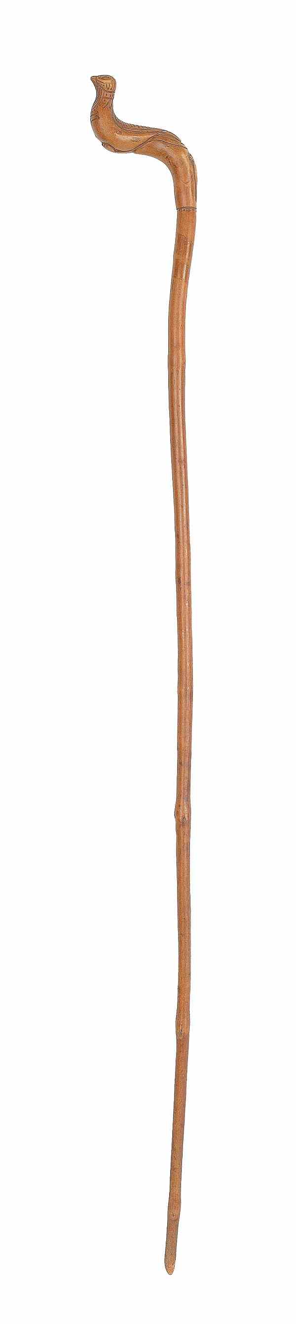 Appraisal: Carved cane late th c with a bird grip l