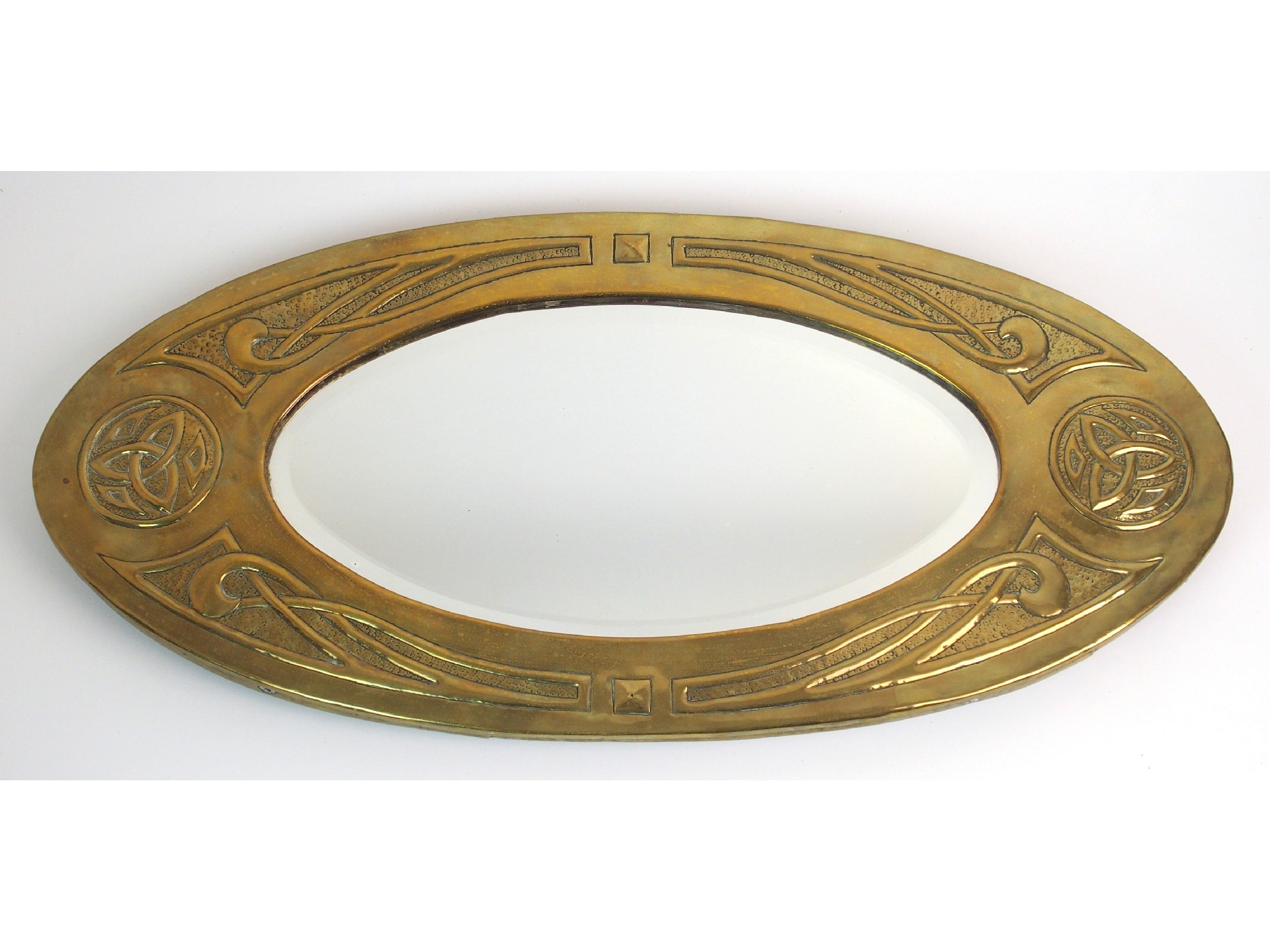 Appraisal: An Arts Crafts Margaret Gilmour-style brass mirroroval-form brass frame with