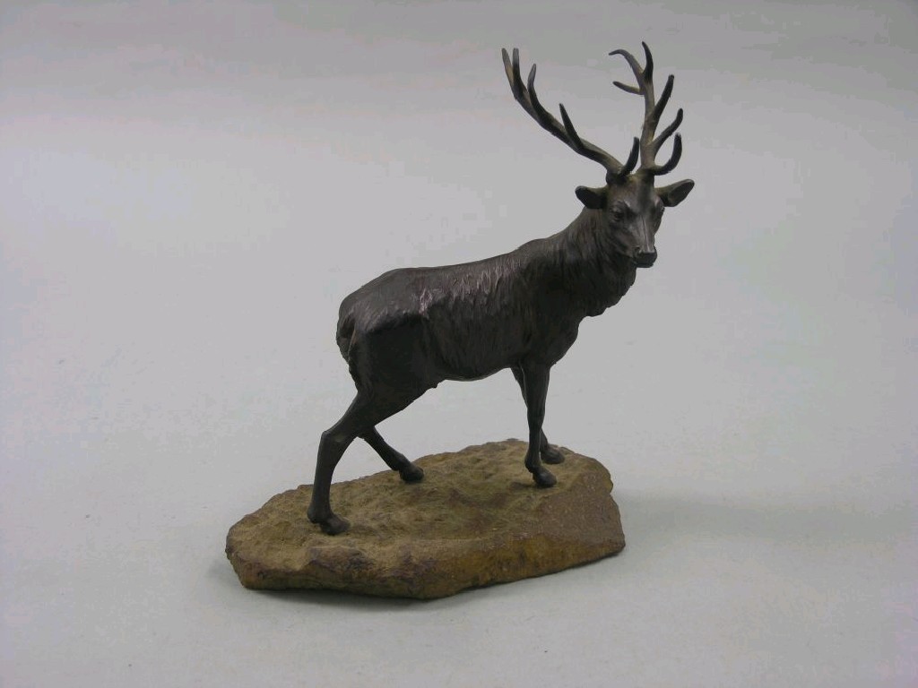 Appraisal: A bronzed metal stag standing four square on mineral base