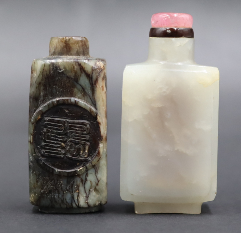 Appraisal: ANTIQUE CHINESE WHITE AND BLACK JADE SNUFF BOTTLES Includes a