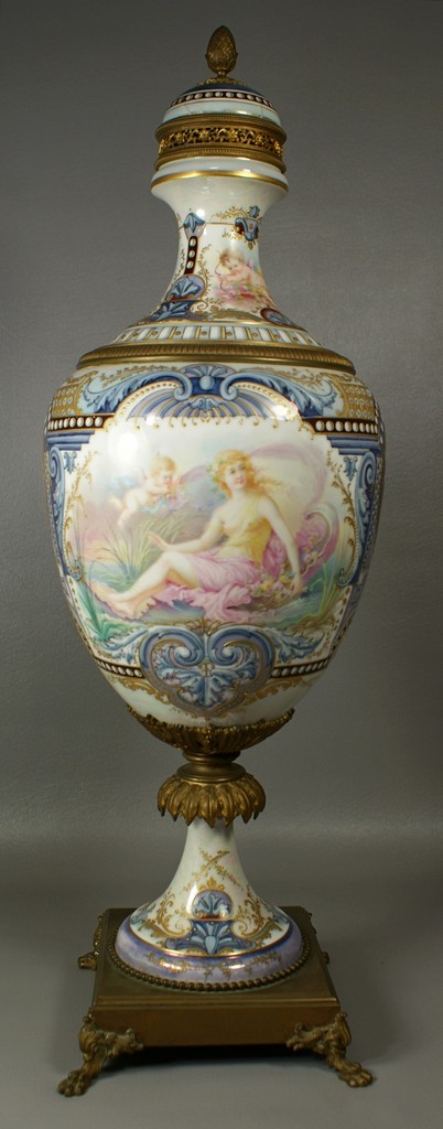 Appraisal: Sevres porcelain lidded urn extensive maiden and cherub decoration beaded