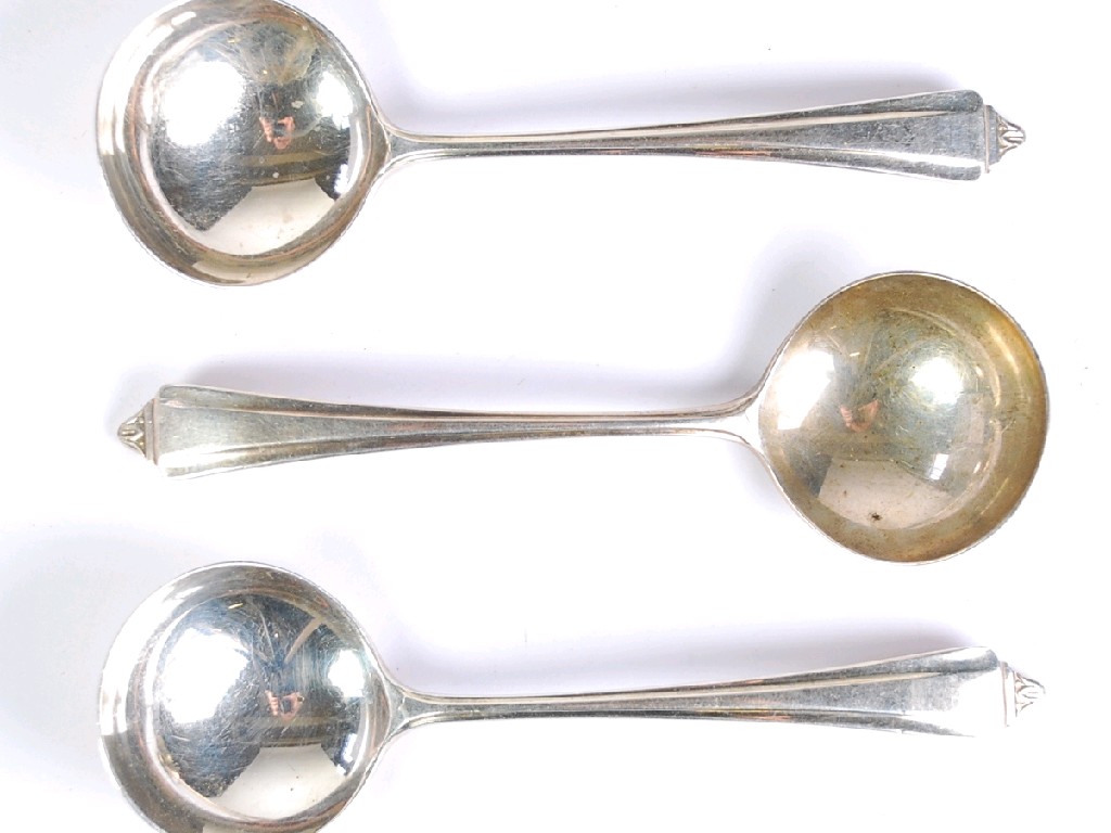 Appraisal: GEORGE VI SET OF THREE SILVER SAUCE LADLES with point