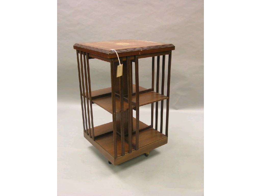 Appraisal: An inlaid mahogany revolving bookcase top with batswing roundel two