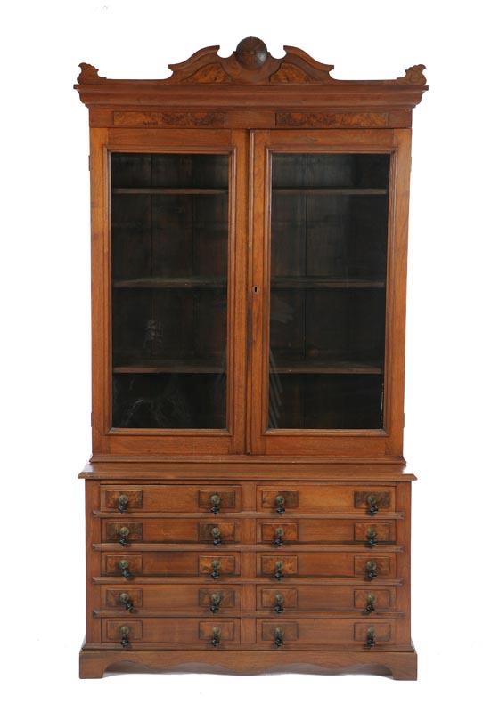 Appraisal: TWO PIECE VICTORIAN BOOKCASE Walnut with a carved crest and