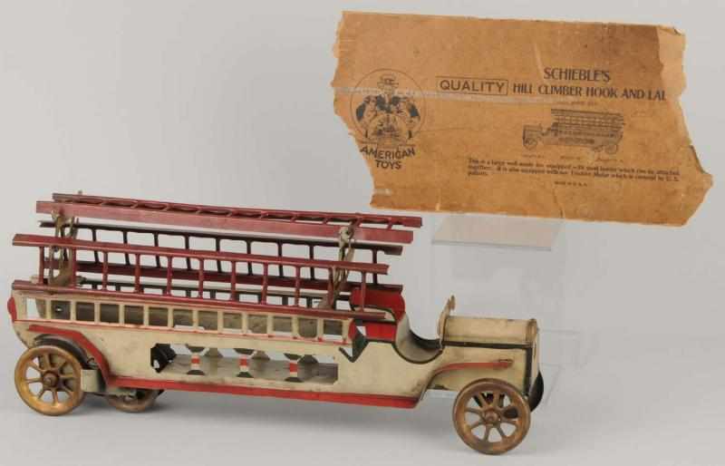 Appraisal: Pressed Steel Schieble's Hook Ladder Truck Toy Description Hill climber