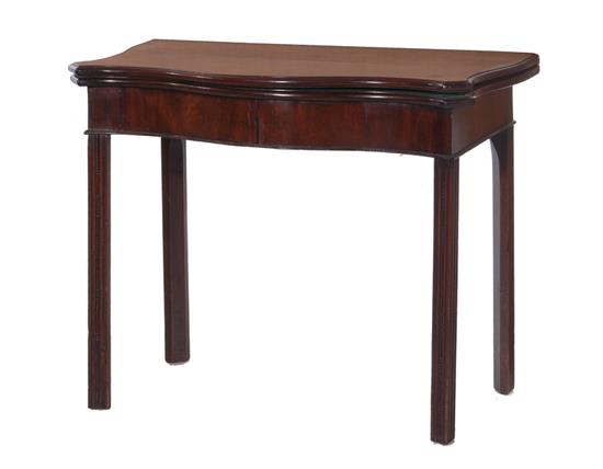 Appraisal: George III mahogany serpentine games table circa hinged top over