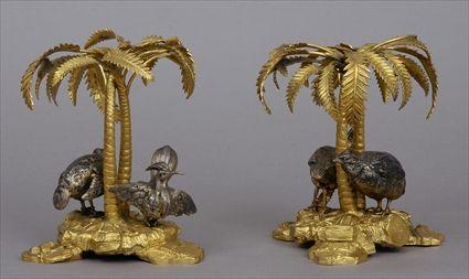 Appraisal: PAIR OF ELKINGTON CO GILT-METAL AND SILVER-PLATED ARMORIAL STANDS With