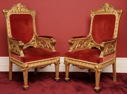 Appraisal: PAIR OF RENAISSANCE-STYLE CARVED GILTWOOD ARMCHAIRS Each with shaped crest