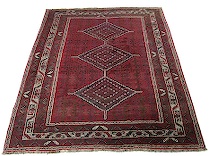 Appraisal: Quashqai Rug Bright red central panel is woven with three