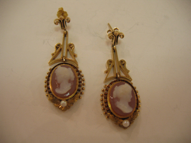 Appraisal: CAMEO EARRINGS Dangling pierced earrings with two signed cameos and