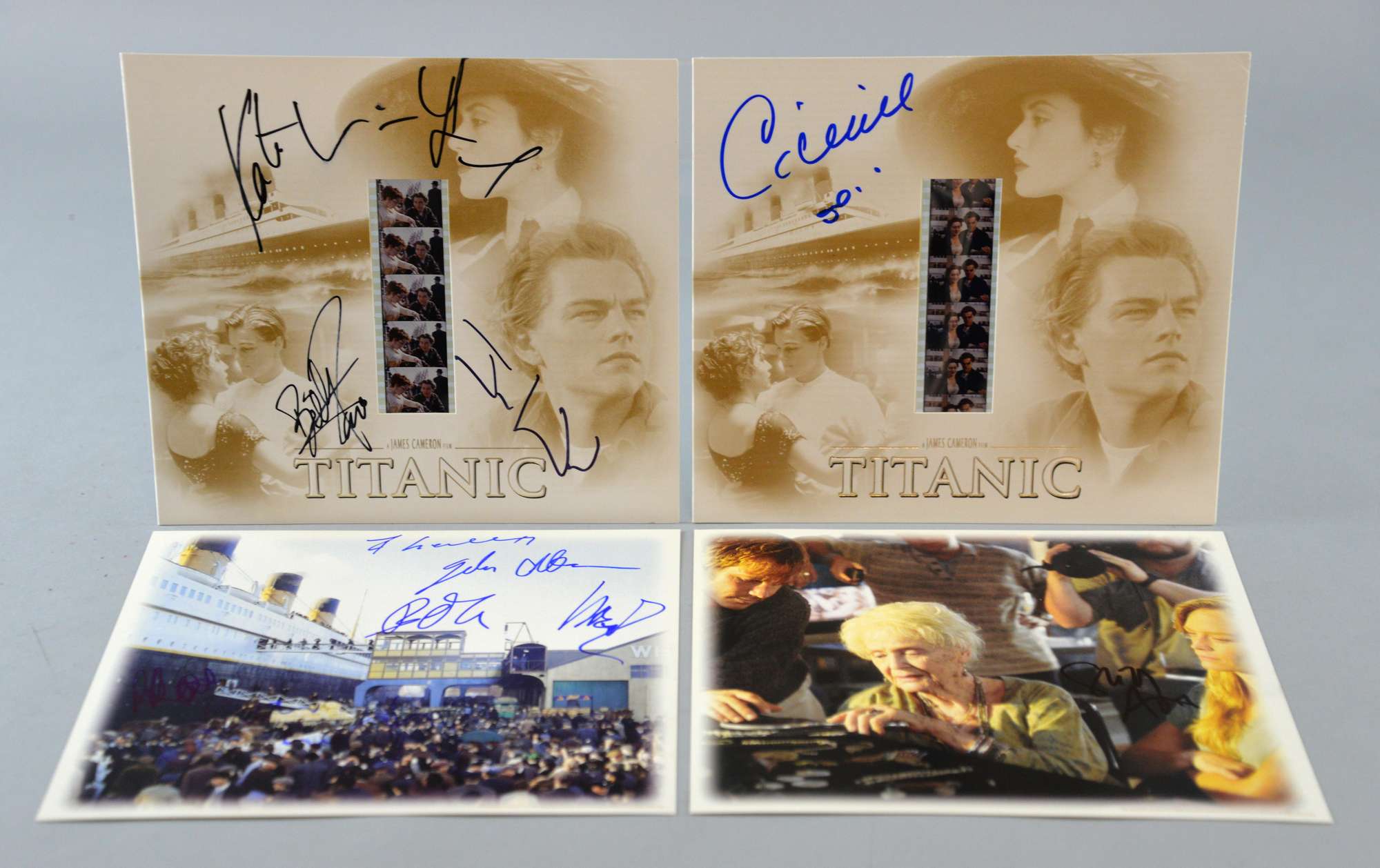 Appraisal: Titanic two signed mounted film clips one by Celine Dion