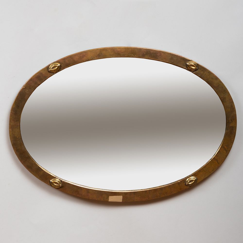 Appraisal: Arts and Crafts Style Planished Brass Oval Mirror x in