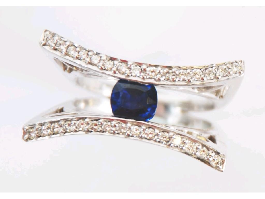 Appraisal: ct WHITE GOLD DESIGNER RING set with a centre sapphire