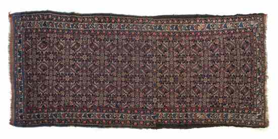 Appraisal: A Kurdish Wool Runner having repeating geometric decoration on a