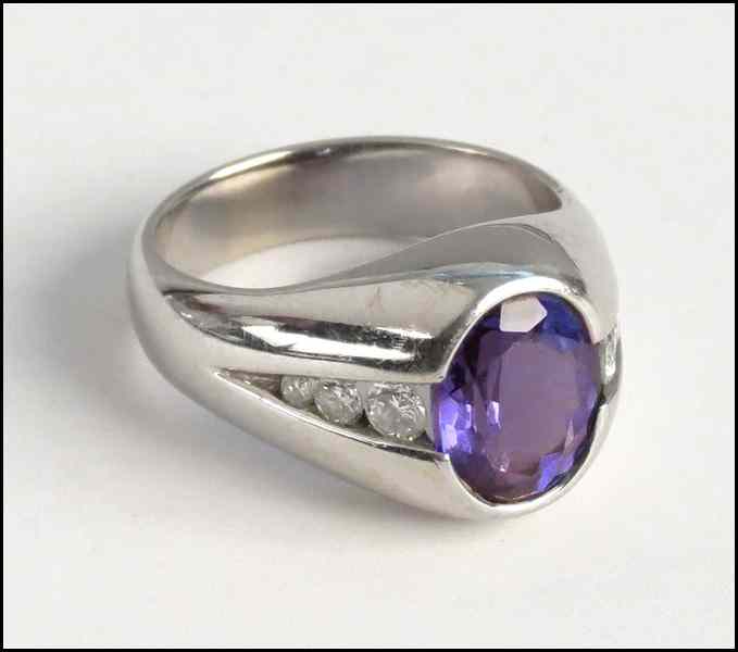 Appraisal: TANZANITE DIAMOND AND KARAT WHITE GOLD RING Oval Tanzanite is