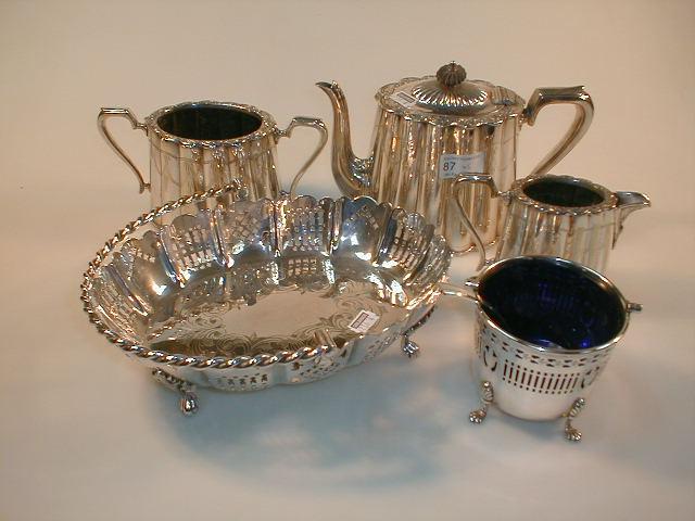 Appraisal: An electroplate three piece tea service a cake basket with