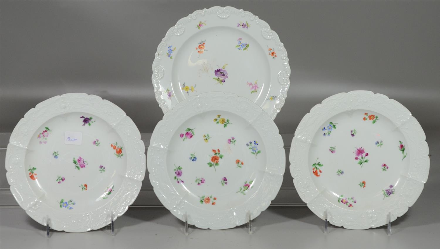 Appraisal: Hand painted floral decorated Meissen plates blue crossed sword underglaze