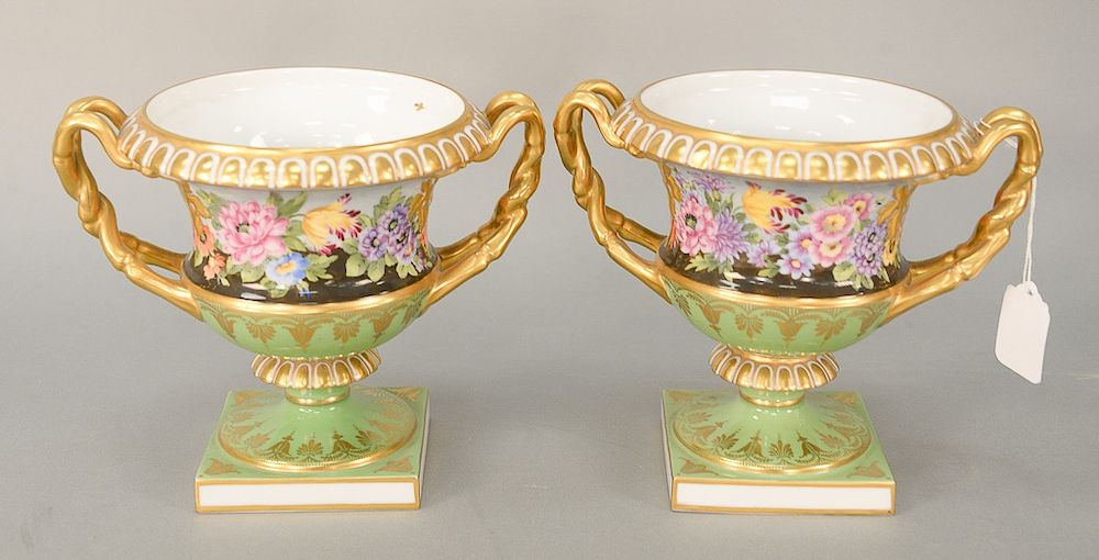 Appraisal: Pair of porcelain urns with painted flowers and gilt gold